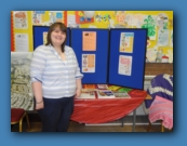 Emma Fleming (family Support Worker in St Andrew's) with the St Andrew's poster display